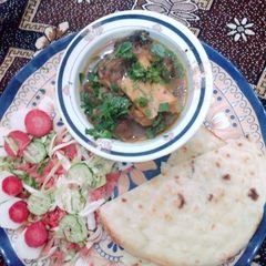 A picture of Beef paye with naan.