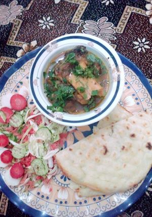 A picture of Beef paye with naan.