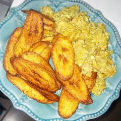 Fried plantains with irish potatoes egg sauce A picture of Fried plantains with irish potatoes egg sauce.