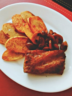 Una foto de Costillar al vino tinto