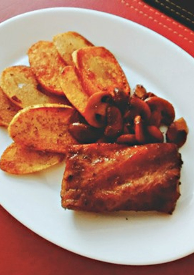 Una foto de Costillar al vino tinto
