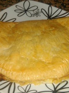 Una foto de Empanada de jamón york & queso en lonchas