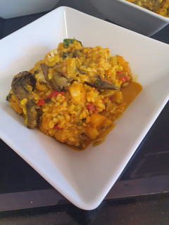 Una foto de Arroz meloso con rape, ajetes y alcachofas