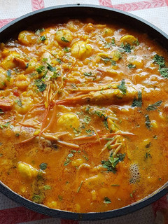 Una foto de Arroz caldoso de vieiras y gambas