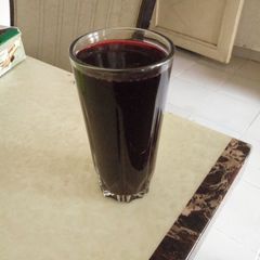 A picture of Mint leaf and hibiscus drink.