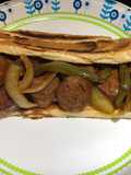Bite Sized Baked Sausages with Peppers and Onions