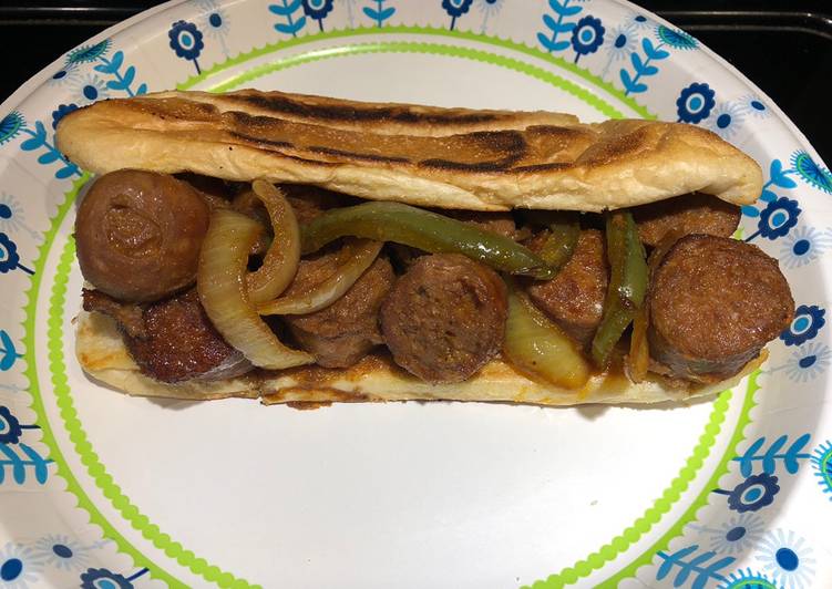 The BEST of Bite Sized Baked Sausages with Peppers and Onions