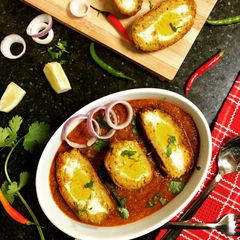 A picture of Veg. Nargisi Kofta in Tomato Gravy.