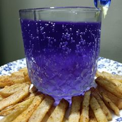 A picture of Masala Crispy French Fries with Blue heaven Drink.