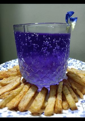 A picture of Masala Crispy French Fries with Blue heaven Drink.