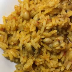A picture of Jollof rice and beans.