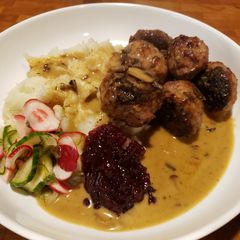 A picture of Swedish Meatballs in Gravy with Sweet Pickles and Lingonberry.