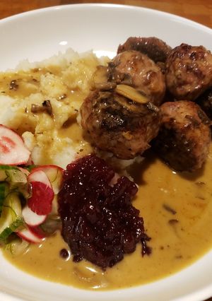 A picture of Swedish Meatballs in Gravy with Sweet Pickles and Lingonberry.