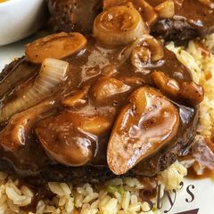 A picture of Air Fryer Salisbury Steak with Mushroom and Onion Gravy.