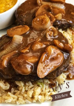 A picture of Air Fryer Salisbury Steak with Mushroom and Onion Gravy.