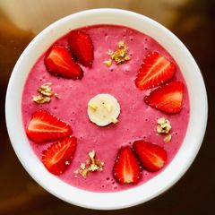 A picture of Strawberry banana beet oatmeal smoothie bowl.