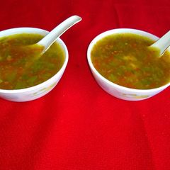 A picture of Corn and vegetable soup.