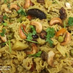 A picture of Cook with dry fruits vegetables tehiri.