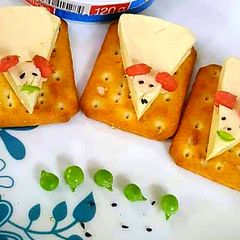 A picture of Cheese mouse on biscuits.