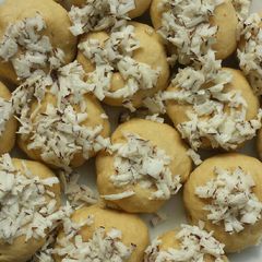 A picture of Baked dougnut with coconut iced.