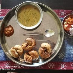A picture of Daal Baati and Lehsun chutney.
