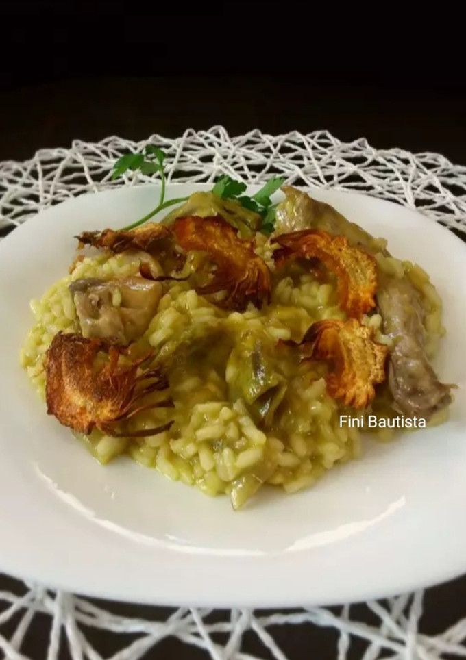 Una foto de Risotto de conejo y alcachofas