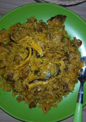 A picture of Jollof rice and beans with locustbeans cake(Daddawa).