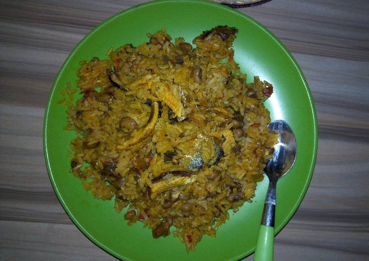 Jollof rice and beans with locustbeans cake(Daddawa)