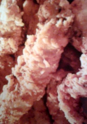A picture of Fried chicken fingers with a tang dip sauce.