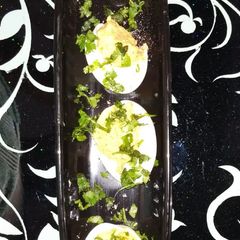A picture of Boiled Egg with masala yolk.