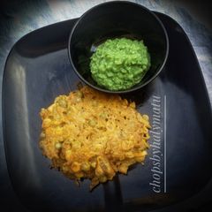 A picture of Veggies pancake with green pea chutney.