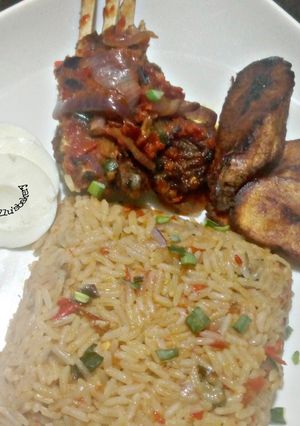 A picture of Peppered Ram meat and jallof rice.