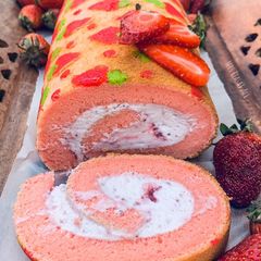 A picture of Three layer Strawberry 🍓 Swiss roll.