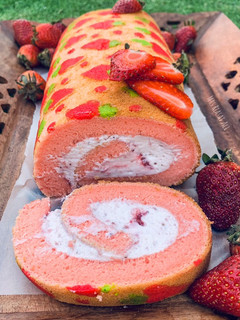 A picture of Three layer Strawberry 🍓 Swiss roll.