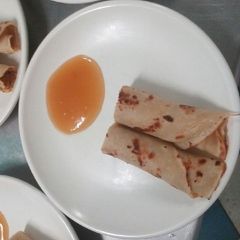 A picture of Lemon pancakes & apricot jam.