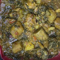 A picture of Potatoes and plantain porridge with vegetable.