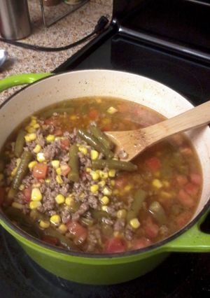 A picture of CowBoy Stew with White rice.