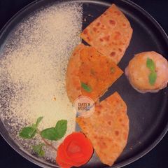 A picture of Sattu ka paratha with aloo ka chokha.