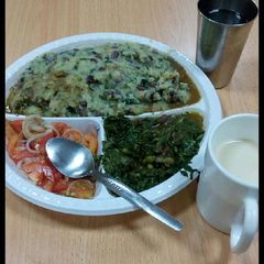 A picture of Mokimo,kachumbari with greens.
