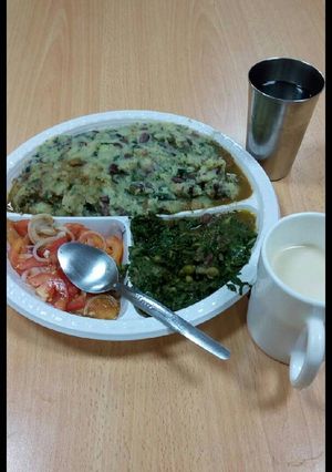 A picture of Mokimo,kachumbari with greens.
