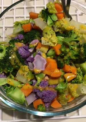 A picture of Microwave veggies salad with poppyseed dressing.