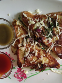 A picture of Egg cheese herbal bread toast.