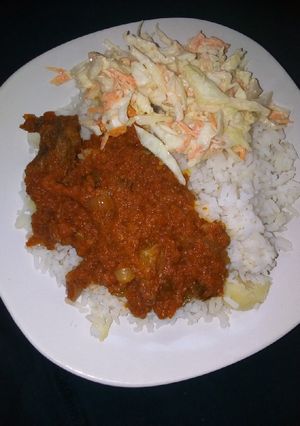 A picture of White rice with stew.