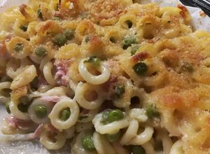 Foto di Anelletti siciliani al forno con piselli e prosciutto cotto