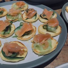 A picture of Smoked Salmon Blinis 🥞.