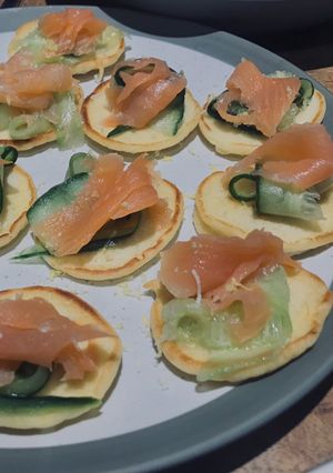 A picture of Smoked Salmon Blinis 🥞.