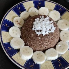 A picture of Ragi Puttu with coconut milk.