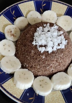 A picture of Ragi Puttu with coconut milk.