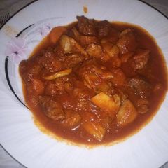 A picture of Village way meat with mushrooms 🍖 🍄.