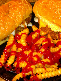 A picture of Kentucky style fried cat fish sandwiches and fries!!!.
